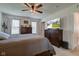 Main bedroom with two dressers, two windows, and a ceiling fan at 2500 Sand Hollow Dr, Lebanon, IN 46052
