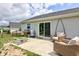 Back patio with a grill, outdoor seating, and a sliding glass door leading into the home at 2500 Sand Hollow Dr, Lebanon, IN 46052