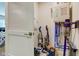 This closet-sized storage room has multiple cleaning appliances and a water heater at 2500 Sand Hollow Dr, Lebanon, IN 46052