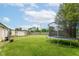 Lush backyard with a trampoline, shed, and green lawn, perfect for Gathering fun at 26858 State Road 19, Arcadia, IN 46030
