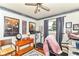 Spare bedroom featuring treadmill, vintage posters, and wood floors at 26858 State Road 19, Arcadia, IN 46030
