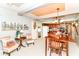 Cozy dining area featuring a dark wood table, plush seating, and an open view into the adjacent kitchen at 26858 State Road 19, Arcadia, IN 46030