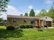 Beautifully landscaped front yard with lush green grass and charming curb appeal at 26858 State Road 19, Arcadia, IN 46030