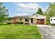Charming brick home with well-maintained lawn, mature landscaping, and lovely curb appeal at 26858 State Road 19, Arcadia, IN 46030