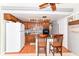 Functional kitchen with ample cabinet space, a white refrigerator, and breakfast bar seating at 26858 State Road 19, Arcadia, IN 46030