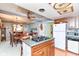 Charming kitchen with an island cooktop, modern appliances, and adjacent dining area at 26858 State Road 19, Arcadia, IN 46030