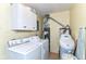 Functional laundry area with white appliances and storage cabinets at 26858 State Road 19, Arcadia, IN 46030