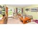 Cozy living room with comfortable seating, area rug, and view to a landscaped front yard at 26858 State Road 19, Arcadia, IN 46030