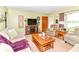 Comfortable living room featuring a fireplace and neutral color palette, with a view of the front door at 26858 State Road 19, Arcadia, IN 46030