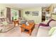 Spacious living room featuring comfortable seating, neutral color palette, and view to the front yard at 26858 State Road 19, Arcadia, IN 46030