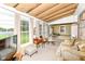Inviting sunroom featuring a cozy seating area, natural light, and a relaxing atmosphere at 26858 State Road 19, Arcadia, IN 46030
