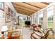 Bright sunroom filled with natural light, comfortable seating, and views of the yard at 26858 State Road 19, Arcadia, IN 46030