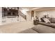 A finished basement with a large sectional sofa, TV, built in shelving, and recreation area at 2783 W High Grove Cir, Zionsville, IN 46077