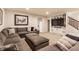 Finished basement boasting a large sectional sofa, built-in shelves, and carpet flooring at 2783 W High Grove Cir, Zionsville, IN 46077