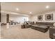 Spacious carpeted basement with a large sectional sofa and recreational area with toys and basketball hoop at 2783 W High Grove Cir, Zionsville, IN 46077