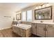 Luxurious bathroom boasts a soaking tub, separate vanities, and modern fixtures at 2783 W High Grove Cir, Zionsville, IN 46077