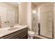 Bathroom featuring a shower with glass doors, a single sink vanity, and a toilet at 2783 W High Grove Cir, Zionsville, IN 46077