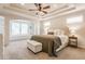 Serene main bedroom with a tray ceiling, reading nook, and plush carpeting at 2783 W High Grove Cir, Zionsville, IN 46077