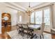 Inviting dining area with hardwood floors, chandelier, and view of the foyer at 2783 W High Grove Cir, Zionsville, IN 46077
