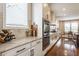 Bright, updated kitchen features stainless steel appliances, granite countertops, and hardwood floors at 2783 W High Grove Cir, Zionsville, IN 46077