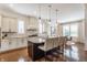 Bright kitchen features center island, pendant lighting, and stainless-steel appliances at 2783 W High Grove Cir, Zionsville, IN 46077