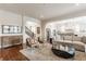Inviting living room featuring hardwood floors, neutral decor, and open access to the kitchen at 2783 W High Grove Cir, Zionsville, IN 46077