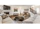 Well-lit living room with a fireplace and decorative features at 2783 W High Grove Cir, Zionsville, IN 46077