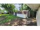 View of backyard with shed, tree, and ladder leaning against the structure at 2807 Carla Ct, Indianapolis, IN 46219