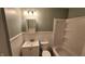 Cozy bathroom featuring a vanity with storage, a toilet, wainscoting, and a shower-tub combination at 2807 Carla Ct, Indianapolis, IN 46219