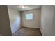 Bright bedroom with neutral paint, carpet flooring, baseboard trim and a window for natural light at 2807 Carla Ct, Indianapolis, IN 46219