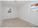 Bright bedroom with neutral carpet and natural light from two windows at 2807 Carla Ct, Indianapolis, IN 46219
