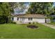 Charming single-story home with a well-manicured lawn and inviting curb appeal at 2807 Carla Ct, Indianapolis, IN 46219