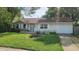 Charming single-story home with a well-maintained lawn and flowerbeds in a peaceful residential neighborhood at 2807 Carla Ct, Indianapolis, IN 46219