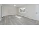 This light-filled living space features updated flooring and crisp white walls at 2807 Carla Ct, Indianapolis, IN 46219