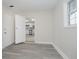 Living room featuring an open doorway to a kitchen with stainless steel appliances at 2807 Carla Ct, Indianapolis, IN 46219