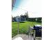 Backyard with a trampoline, grass, shed, and a grill at 2826 Falcon Dr, Indianapolis, IN 46222
