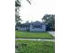 Cozy single-story home featuring a neat front yard and a covered carport at 2826 Falcon Dr, Indianapolis, IN 46222