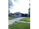 Charming ranch-style home with a well-manicured lawn and convenient covered parking at 2826 Falcon Dr, Indianapolis, IN 46222