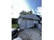 Exterior of a light gray outbuilding or garage with a door at 2826 Falcon Dr, Indianapolis, IN 46222
