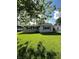 Well-maintained home with lush green lawn and side carport, offering ample space at 2826 Falcon Dr, Indianapolis, IN 46222