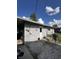 The backyard features a light gray outbuilding or garage at 2826 Falcon Dr, Indianapolis, IN 46222