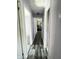 Hallway with gray wood-look floors and lavender walls connecting rooms at 2826 Falcon Dr, Indianapolis, IN 46222