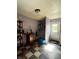 Efficient pantry with storage shelves, checkered flooring, and exterior access at 2826 Falcon Dr, Indianapolis, IN 46222