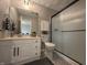 Bathroom showcasing shower, toilet, vanity with mirror, and accent lighting at 2845 12Th St, Columbus, IN 47201