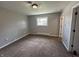 Bedroom showcasing carpet floors, painted walls, window and white trim at 2845 12Th St, Columbus, IN 47201