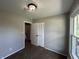 Bedroom features neutral walls, closet with louvered doors, and ample natural light from the window at 2845 12Th St, Columbus, IN 47201