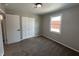 Bedroom showcasing carpet floors, painted walls, window and double door closet at 2845 12Th St, Columbus, IN 47201