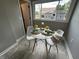 Dining area featuring large window, natural light, modern table, chairs, and decor at 2845 12Th St, Columbus, IN 47201