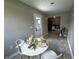 Dining area with a door to the backyard, modern decor, tile flooring, and neutral walls at 2845 12Th St, Columbus, IN 47201