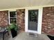 Inviting front entrance with decorative wreath and modern exterior lighting at 2845 12Th St, Columbus, IN 47201